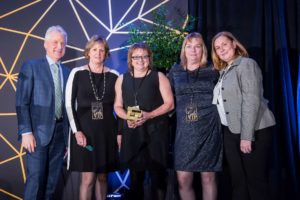 Kathy, Brenda, Mary Anne and Angela holding the Chamber of Commerce business excellence award received for health and wellness in the workplace.