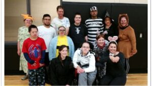 Participants of the Core Dream club program dressed up for Halloween and posing for a picture.