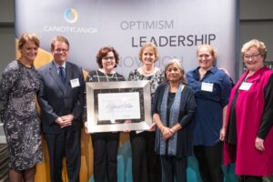 Several of our Board Members and Capacity Canada Executives holding an award received from Capacity Canada for Board Governance.