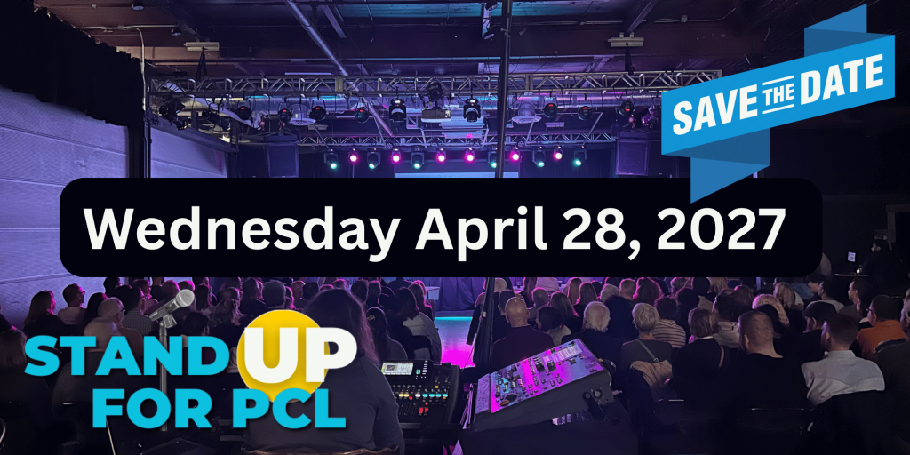 Audience gathered at a stage event; a large rounded black banner displays 'Wednesday April 28, 2027' with a blue 'Save the Date' ribbon, plus 'Stand Up For PCI' branding in the corner.] ,